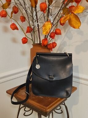 Dooney & Bourke Black Leather Crossbody with Silver Tone Charm